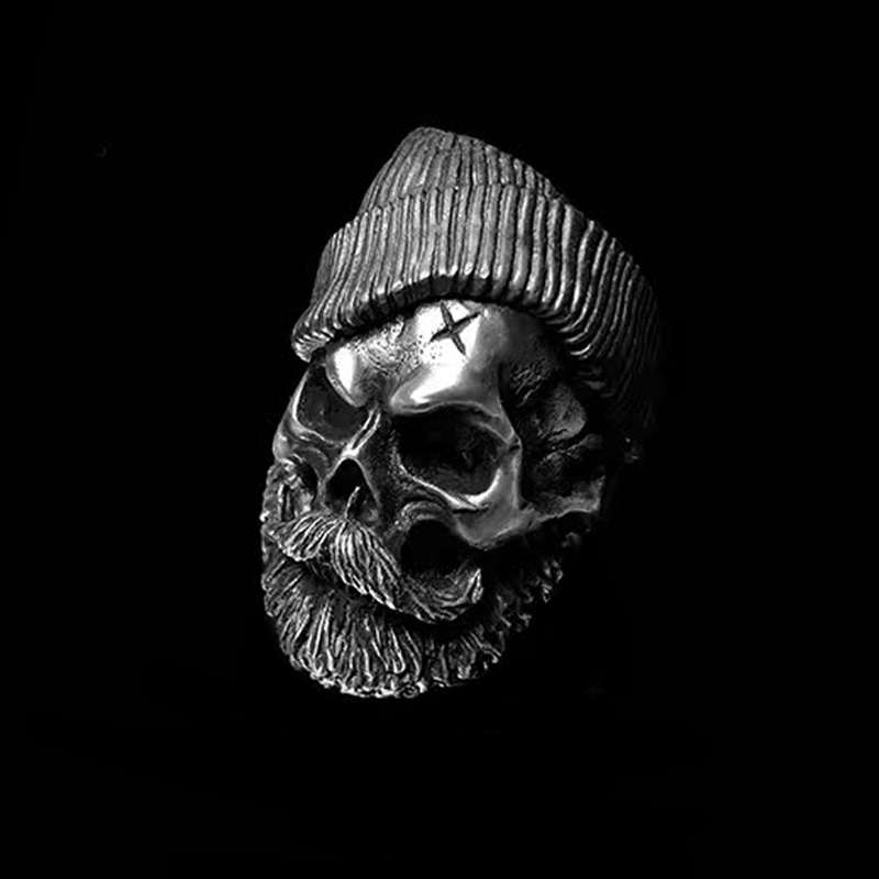Bearded tough guy wearing hat skull rings for men